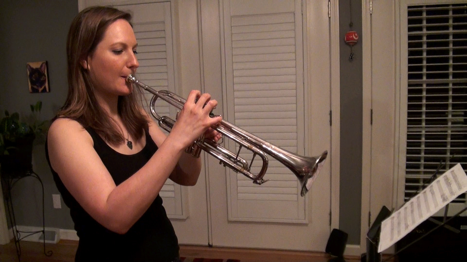Kim plays trumpet as well as handling vocals, acoustic guitar, and piano. 